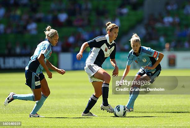 Amy Jackson of the Victory controls the ball under pressure from the Sydney defence during the W-League Grand Final between the Melbourne Victory and...