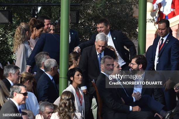 Chile's ex-President Sebastian Piñera takes his seat behind King Felipe VI of Spain , Argentine President Alberto Fernandez and Chile's President...