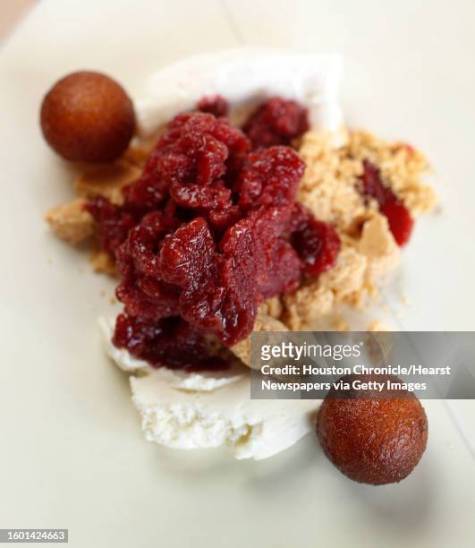 Tamarind Rose dessert, rose namesake, tamarind hibiscus granite, and gulab jamun at James Beard Award-winning chef Paul Qui's new restaurant, Aqui,...