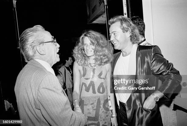 View, from left, of Bravo magazine writer Ralf Brunkow , jewelry designer Ann Dexter-Jones, and Rock musician Mick Jones, of the band Foreigner, as...