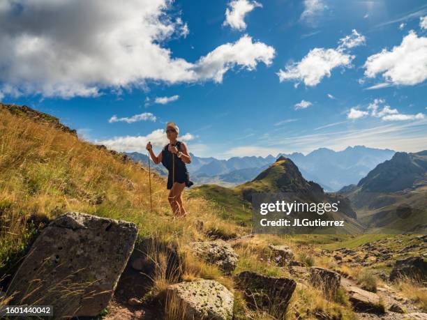 woman hiking in the pyrenees of huesca, spain - pyrenees stock pictures, royalty-free photos & images