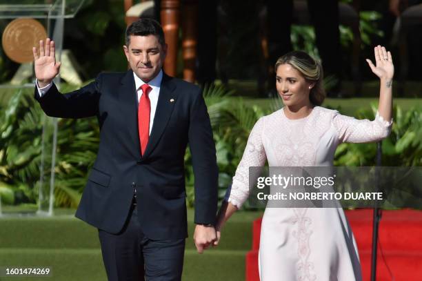 Paraguay's new Vice-President Pedro Alliana and his wife Fabiana Maria Souto wave during the presidential inauguration ceremony at the esplanade of...