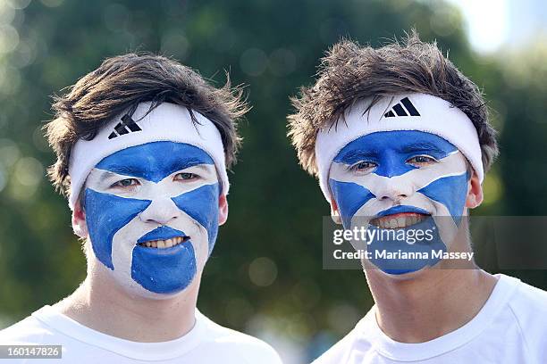 Andy Murray fans ahead of the men's final during day fourteen of the 2013 Australian Open at Melbourne Park on January 27, 2013 in Melbourne,...