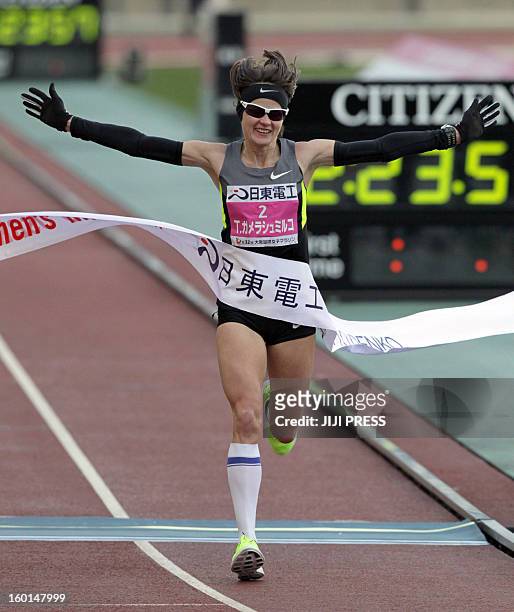 Tetyana Gamera-Shmyrko of Ukraine crosses the finish line of the Osaka international women's marathon at the Nagai stadium in Osaka on January 27,...