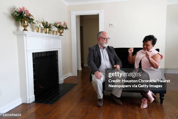 Yolonda Henry and Richard Gianni, LiftFund Inc, Market president of Houston talk together in Henry's new space for her small business, Nuksy's Fine...