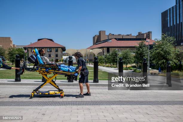 Austin Travis County EMT assist a patient on August 08, 2023 in Austin, Texas. EMT were called after the patient was found passed out and dehydrated...