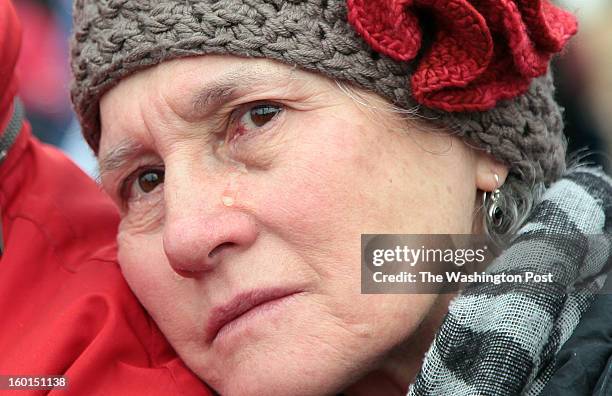 With tears in her eyes, Gertrud Mergner, who is German and lives with her husband in Takoma Park, MD, listens to the speakers of the March on...