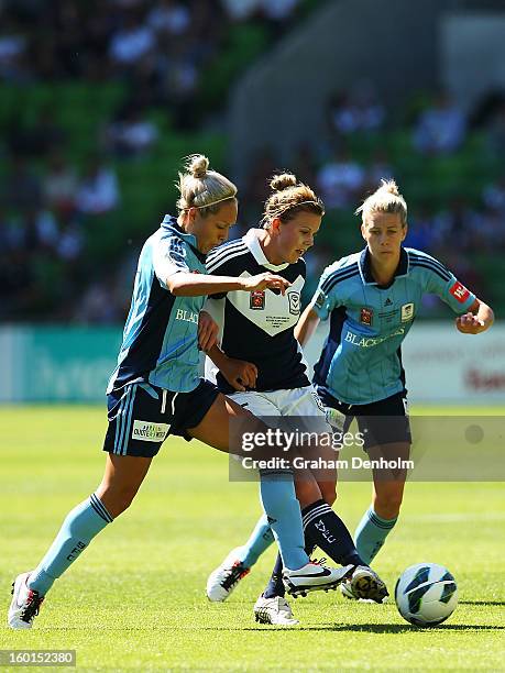 Amy Jackson of the Victory controls the ball under pressure from the Sydney defence during the W-League Grand Final between the Melbourne Victory and...