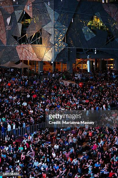 Huge crowds gather at Federation Square to watch the men's final match during day fourteen of the 2013 Australian Open at Melbourne Park on January...