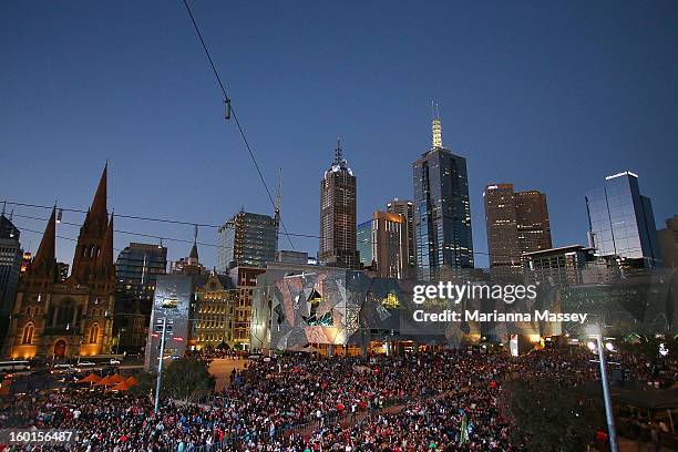 Huge crowds gather at Federation Square to watch the men's final match during day fourteen of the 2013 Australian Open at Melbourne Park on January...