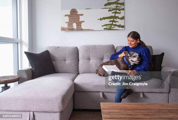 métis woman in her new condo - métis stock pictures, royalty-free photos & images