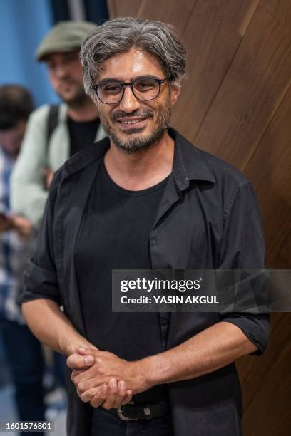 Turkish investigative journalist Baris Pehlivan reacts at his lawyer's office before surrendering himself to the Silivri prison in Istanbul, on...