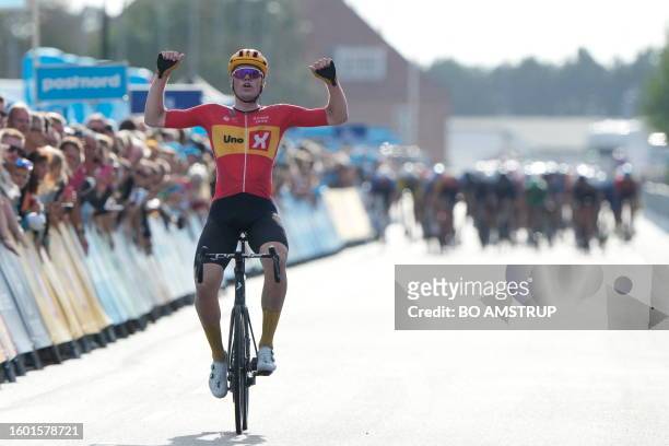 Soeren Waerenskjold of Norway reacts as he crosses the finish line to win the first stage of PostNord Danmark Rundt 2023 in Aalborg, Denmark, on...