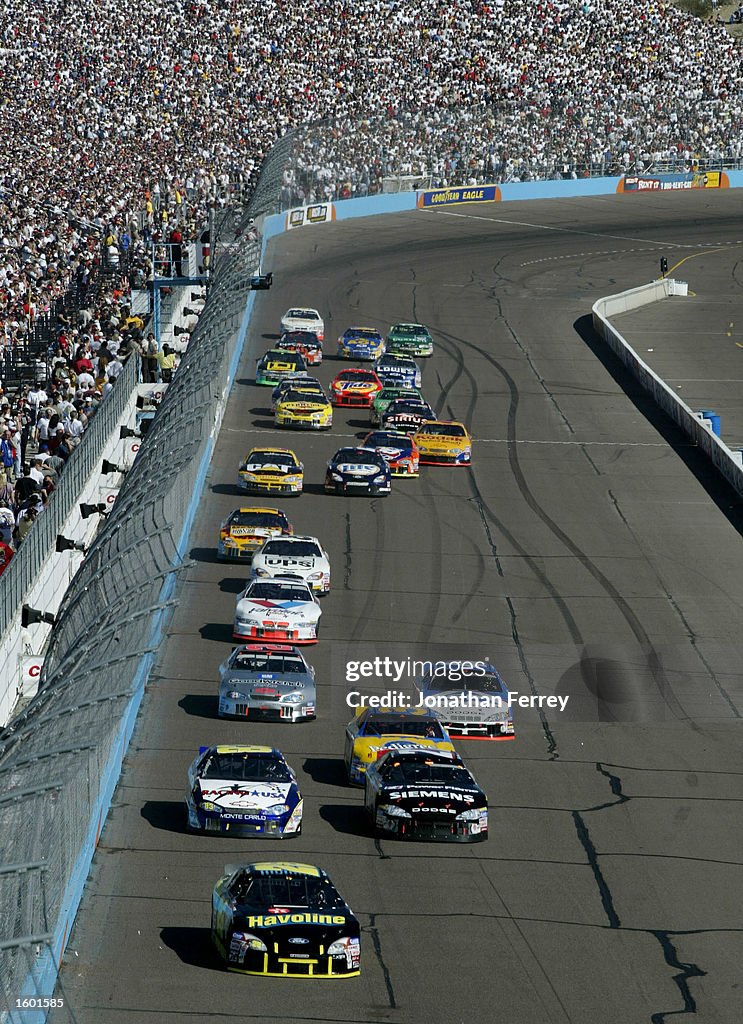 Ricky Rudd 2002 Ricky Rudd Ricky Rudd driving the Havoline Ford heads the down along the front ...