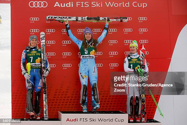 Frida Hansdotter of Sweden takes 2nd place, Tina Maze of Slovenia takes 1st place, Kathrin Zettel of Austria takes 3rd place during the Audi FIS...