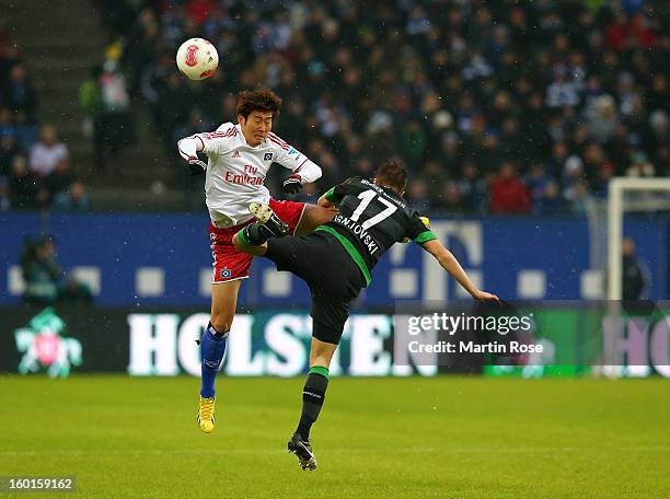 Heung Min Son of Hamburg and Aleksandar Ignjovski of Bremen battle for the ball during the Bundesliga match between Hamburger SV and SV Werder Bremen...