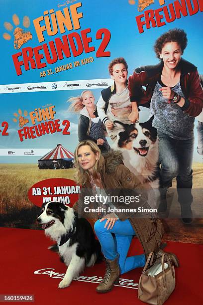 Nina Ruge and dog Coffey attend the 'Fuenf Freunde 2' movie premiere at CineMaxx Cinema on January 27, 2013 in Munich, Germany.