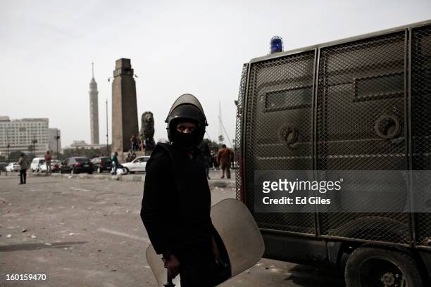 An Egyptian riot policeman stands by an armoured vehicle during a demonstration in Tahrir Square on January 27, 2013 in Cairo, Egypt. Violent...