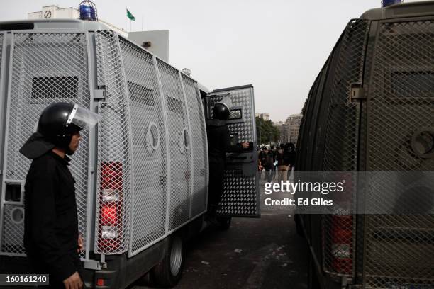 Egyptian riot policemen stand by an armoured vehicle during a demonstration in Tahrir Square on January 27, 2013 in Cairo, Egypt. Violent protests...