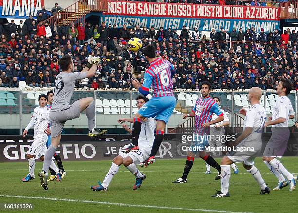 Nicola Legrottaglie of Catania scores his team's equalizing goal during the Serie A match between Calcio Catania and ACF Fiorentina at Stadio Angelo...