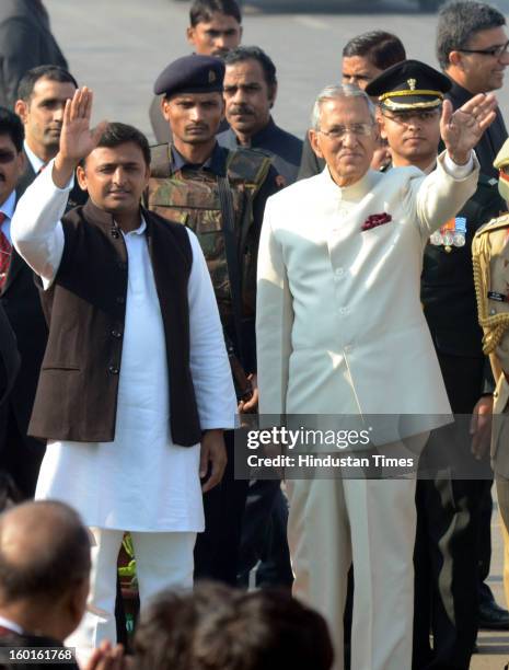 Governor of UP B.L Joshi and Chief Minister Akhilesh Yadav wave their hands during the Republic Day Parade at Vidhan Bhavan on January 26, 2013 in...