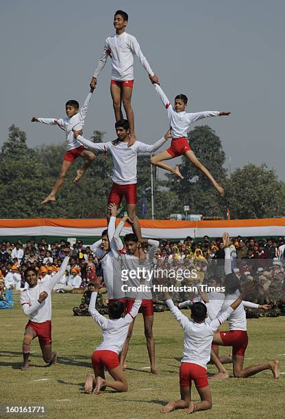 Students of Rao Ram Singh public school perform the YOGA during the 64th Republic Day parade in Devi Lal Stadium on January 26, 2013 in Gurgaon,...