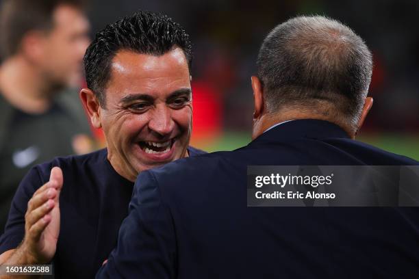 Xavi Hernandez, head coach of FC Barcelona hugs Joan Laporta, president of FC Barcelona during the Joan Gamper Trophy match between FC Barcelona and...