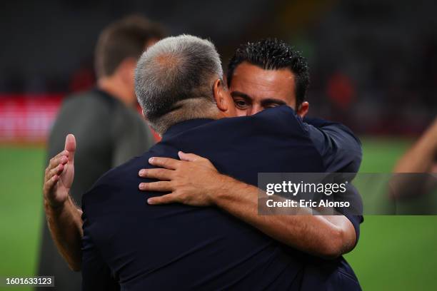 Xavi Hernandez, head coach of FC Barcelona hugs Joan Laporta, president of FC Barcelona during the Joan Gamper Trophy match between FC Barcelona and...