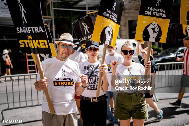 Murray Abraham, Julianna Margulies and Samantha Mathis join the SAG- AFTRA picket line outside the Warner Bros./ Discovery office on August 08, 2023...