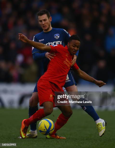 Raheem Sterling of Liverpool competes with Jonathan Grounds of Oldham Athletic during the FA Cup with Budweiser Fourth Round match between Oldham...