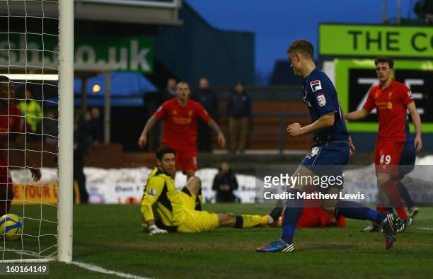 Matt Smith of Oldham Athletic scores his team's second goal during the FA Cup with Budweiser Fourth Round match between Oldham Athletic and Liverpool...