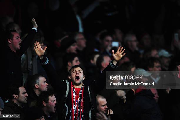 Brentford fans sing during the FA Cup with Budweiser Fourth Round match between Brentford and Chelsea at Griffin Park on January 27, 2013 in...