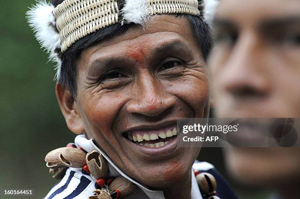 An Ecuadorean Waorani native smiles during a ceremony at the Yasuni National Park, at the Ecuadorean Amazon forest, on August 21, 2010. AFP PHOTO /...