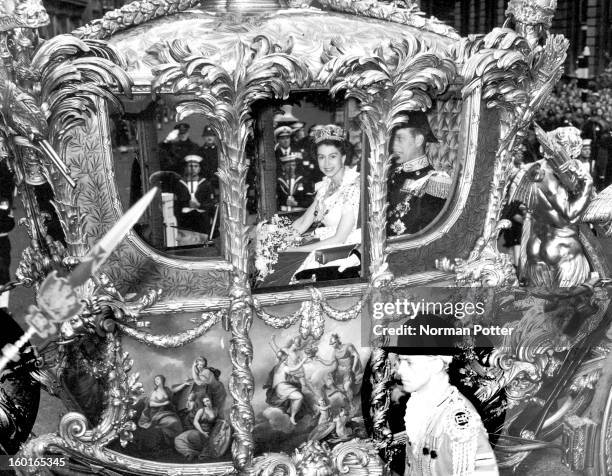 Queen Elizabeth II with Prince Philip, Duke of Edinburgh, in the Coronation Coach en route to Westminster Abbey for Elizabeth's coronation ceremony,...