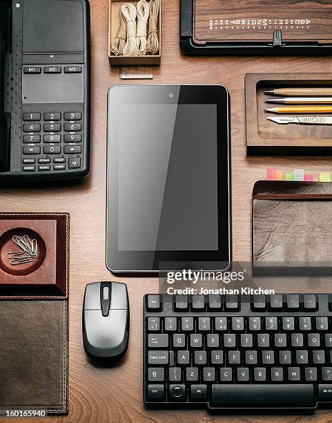 computer tablet on a desk in a angular layout - ipad angle stock pictures, royalty-free photos & images