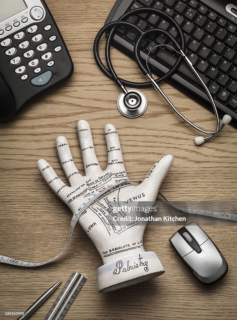 Palmistry hand on surgeons desk