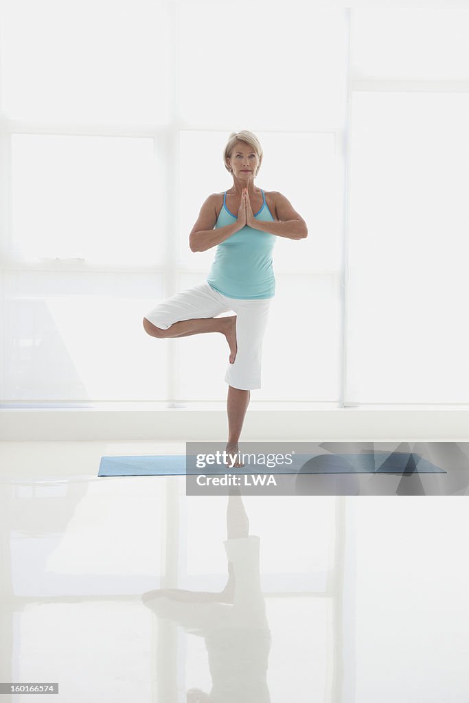 Mature woman doing yoga