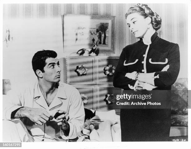 Ray Danton looking up at Elaine Stewart in a scene from the film 'The Rise And Fall Of Legs Diamond', 1960.