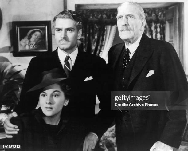 Joan Fontaine, Laurence Olivier and C Aubrey Smith in a scene from the film 'Rebecca', 1940.