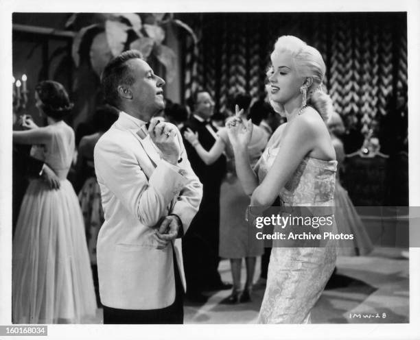 George Gobel and Diana Dors on the dance floor together in a scene from the film 'I Married A Woman', 1958.
