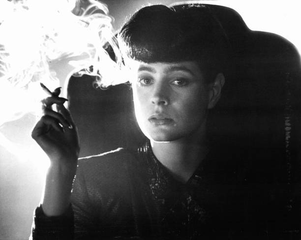 Sean Young smokes in a scene from the film 'Blade Runner', 1982.