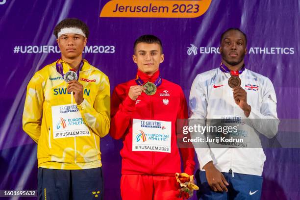 Gold medal winner Marek Zakrzewski of Poland, silver medal winner Isak Hughes of Sweden and bronze medal winner Sean Anyaogu of Great Britain pose...