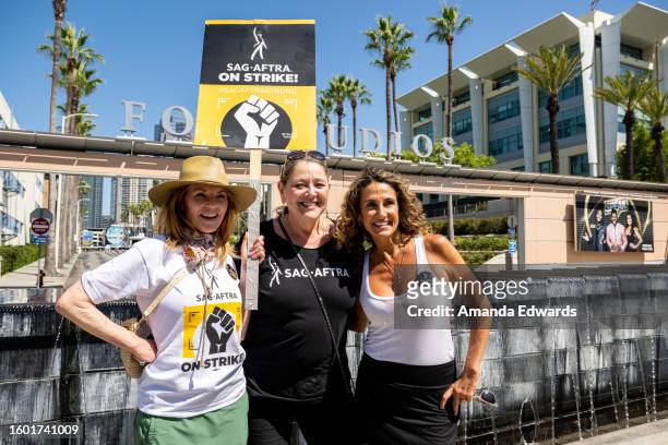 Actresses Marg Helgenberger, Camryn Manheim and Melina Kanakaredes join members and supporters of SAG-AFTRA and WGA on the picket line at Fox Studios...