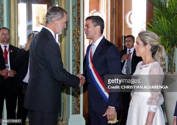 King Felipe VI of Spain greets Paraguay's new President Santiago Peña and his wife First Lady Leticia Ocampos after the inauguration ceremony, at...