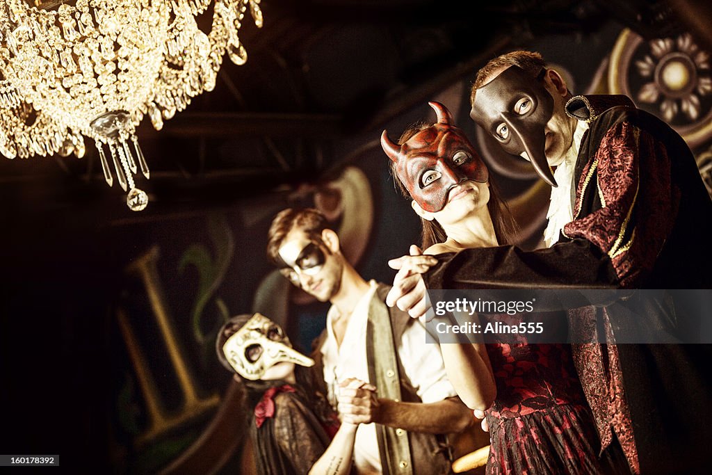 Couples at the masquerade ball