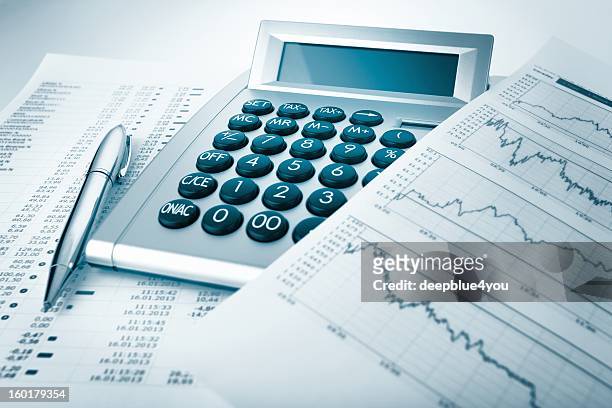 calculator and charts and documents - tax scrutiny stock pictures, royalty-free photos & images