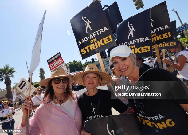 Michelle Forbes, Tara Buck and Nana Visitor walk the picket line at Paramount Studios on August 08, 2023 in Los Angeles, California. Members of...