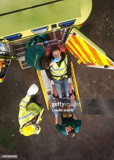 construction site accident - ambulance uk stock pictures, royalty-free photos & images