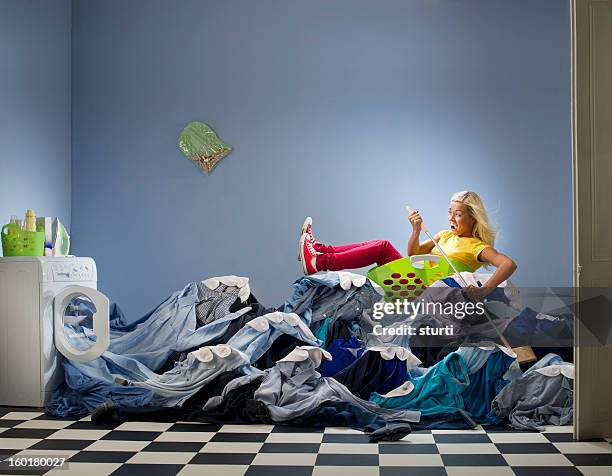 washing overload - housework humour stock pictures, royalty-free photos & images