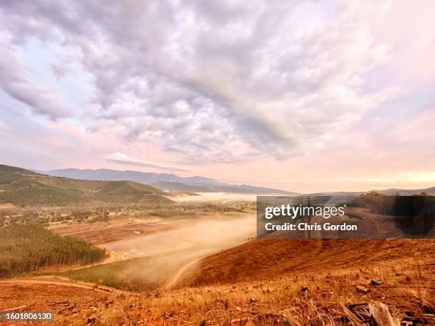 sunrise over valley and mountains - deforestation australia stock pictures, royalty-free photos & images